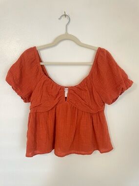 Kirious orange blouse with puff sleeves and neckline detail size medium